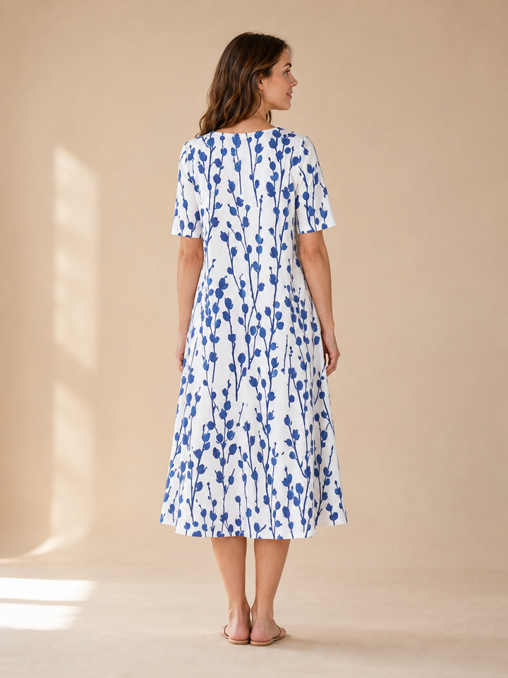 Marina | Kukkaprinttinen laskeutuva midimekko